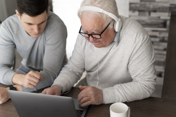 grand-parent-learning-to-use-digital-divice
